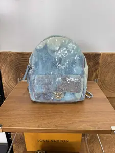 Pre-owned CHANEL Mini Blue Sequin Backpack with Signature Gold Tone Hardware
