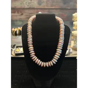 Button baroque silver hued necklace