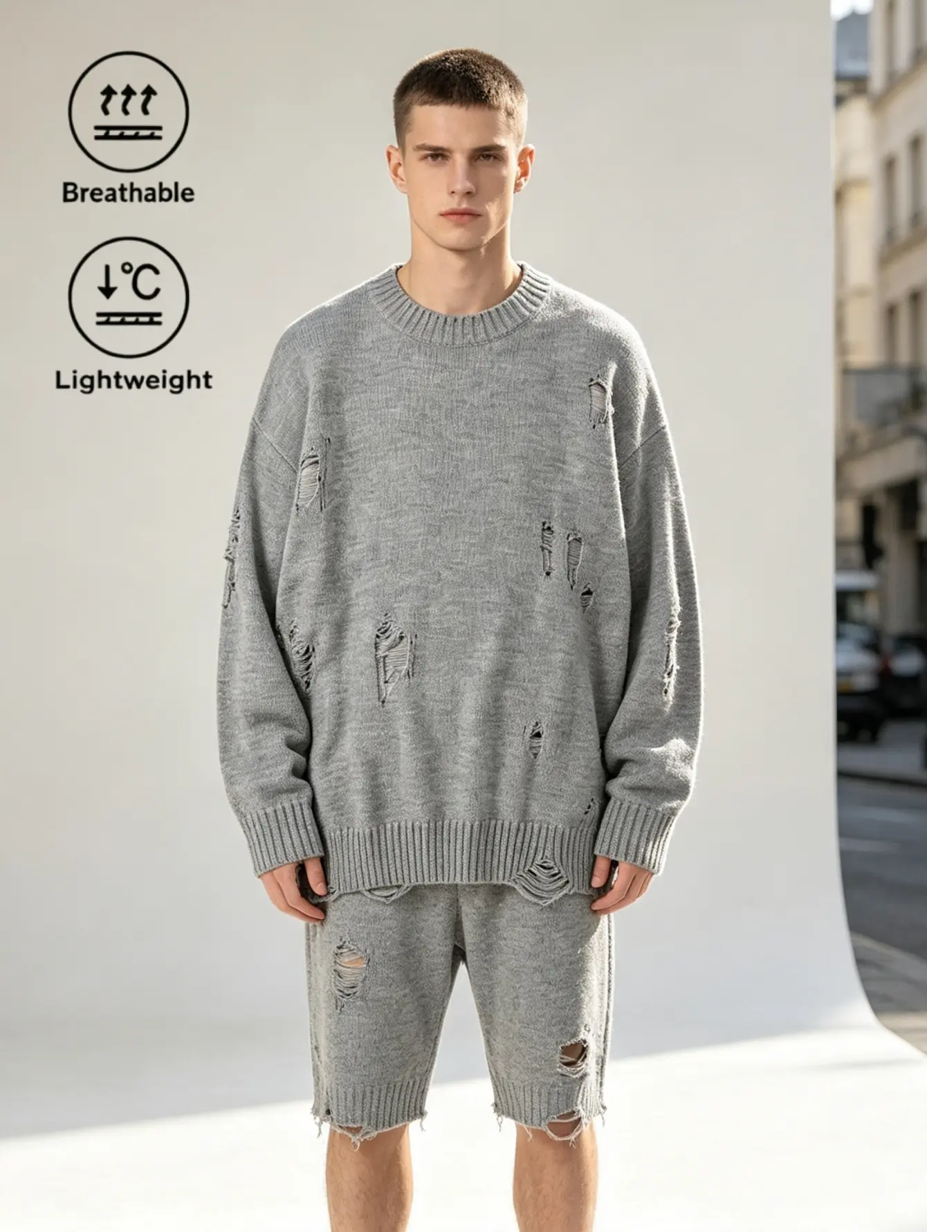 High-street distressed ripped knit sweater in two colors: gray and black, with a loose drop-shoulder fit.