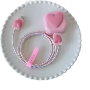 Phone Charger Cover with Pink Heart De|sign and Coiled Cable for Secure and Stylish Charging