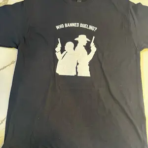 Who Banned Dueling T-Shirt - Black Graphic Tee with Iconic Dueling Design for Trendy Outfits