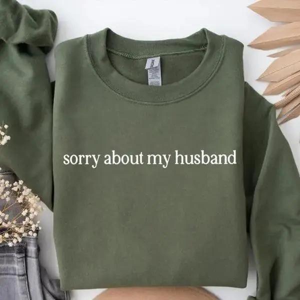 Sorry About My Husband Sweatshirt, a sarcastic and funny crewneck tee perfect for casual wear, sharing laughs, and giving as a playful gift.