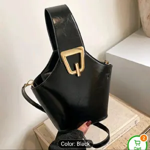 Black Leather Bucket Bag with Gold Buckle and Adjustable Strap for Everyday Use
