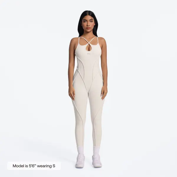 BetterMe Women's Strappy Adjustable Open-Back Cut-Out Catsuit in Ivory – Polyester Spandex Sculpting Jumpsuit, Romper & Overalls Fit for Gym & Everyday Womenswear