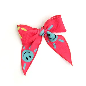 Brittany Smiley Face CLIP BOW
