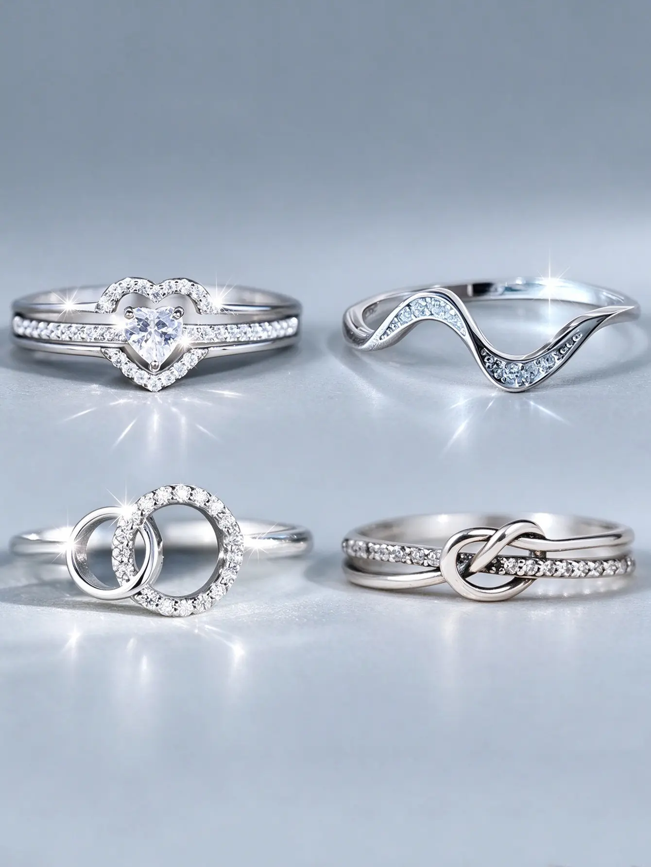Silver-Tone Mixed Design CZ Stackable Ring Set for Women, 4 Pieces – Heart, Wave, Interlocking Circle & Knot Stacking Bands, Delicate Layered Crystal Statement Rings, Trendy Valentine’s Day Everyday Jewelry Gift engagement