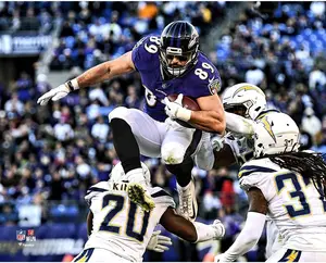 Mark Andrews Baltimore Ravens Unsigned Hurdling Defender Photograph
