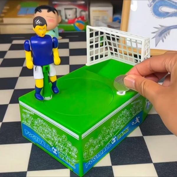 2026 Creative Kicking Soccer Piggy Bank, World Cup Coin Bank, Football-Themed Souvenir Gift, Desktop Decoration, Novel Cartoon Money Bank