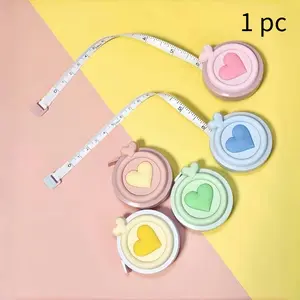 Creative heart-shaped double-sided scale Macaron mini tape measure - portable and multifunctional expandable tape measure for measuring height and body measurements.