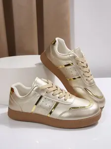 Chic Metallic Champagne Gold Sneakers with Elegant Gold Stripe Accents, Luxurious Vintage Vibe for Stylish Casual Wear