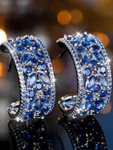Classic sparkling sapphire blue cubic zirconia pattern ladies' earrings. High-end luxury jewellery designed exclusively for women. Party accessories.