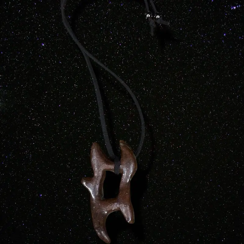 Abstract Maroon Space Necklace with Unique Design and Adjustable Cord for Stylish Wear