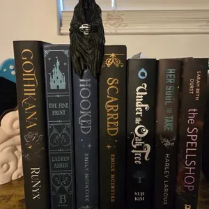 Custimizable book shelf sitting Grim Reaper.