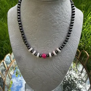 Pink conch and dice beaded necklaces