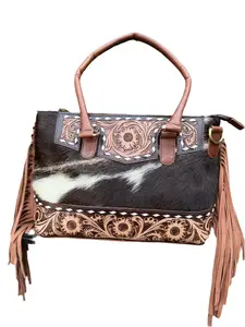 The Frontier Fringe Carryall : Cowhide, tooling, fringe, and function. Includes concealed carry pocket and two ways to wear