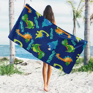 A Custom Name Beach Towel with a Cartoon Dinosaur Design, High-Quality Large  beach towel , Personalized for Summer Beach Outings, Outdoor Travel, Camping, Swimming, And Yoga. It'S an Essential Item for The Beach