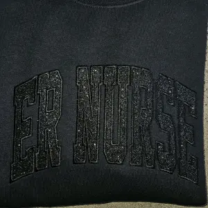 ER Nurse black on black glitter sweatshirt