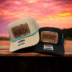 Somebody’s Problem Hat Combo - Beige & Black, Beige Hat features“Somebody’s Problem” patch with turquoise hat chain and Black Hat features “Somebody” patch to complement each other. Both are on OTTO Foam SnapBack Premium Men’s and Women’s Hats.