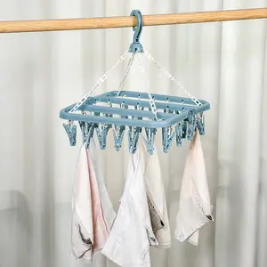 Space-Saving Folding Plastic Clothes Drying Rack Hanger with 32 Rotatable Clips, Ideal for Socks and Small Clothing, Perfect for Bedroom and Laundry Room