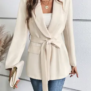 A ladies' peach-colored collarless fitted blazer with belt, featuring a simple style and versatile appeal for casual wear.