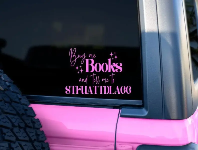 BookTok Car Decal - Buy Me Books and Tell Me to STUATTLAGG Girly Pink Vinyl Sticker 6x5 Inches Easy Application for Cars Laptops Mirrors Doors