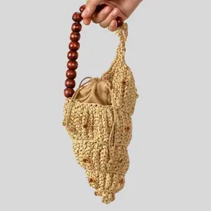 Coral Mini Bag - Handmade Crochet Design with Wooden Beaded Handle and Drawstring Closure for Stylish Everyday Use