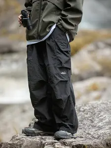 Unisex baggy parachute cargo pants, lightweight water-resistant outdoor hiking trousers, loose-fit gorpcore streetwear pants for men and women with an elastic waistband. Please refer to the size chart to choose your suitable size.