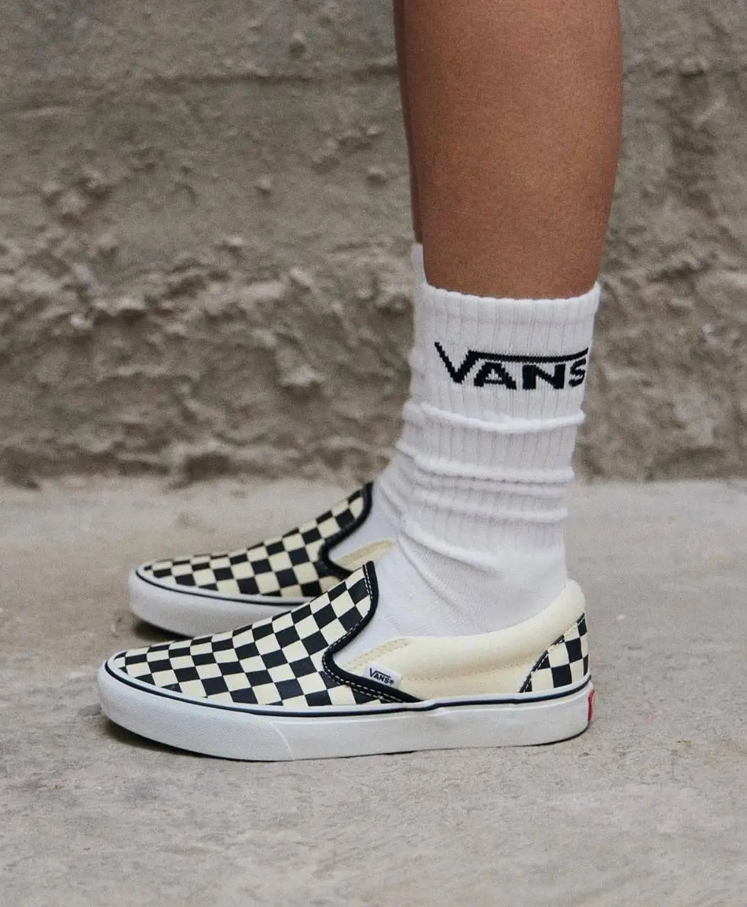 Vans Classic Slip-On Checkerboard Shoes.