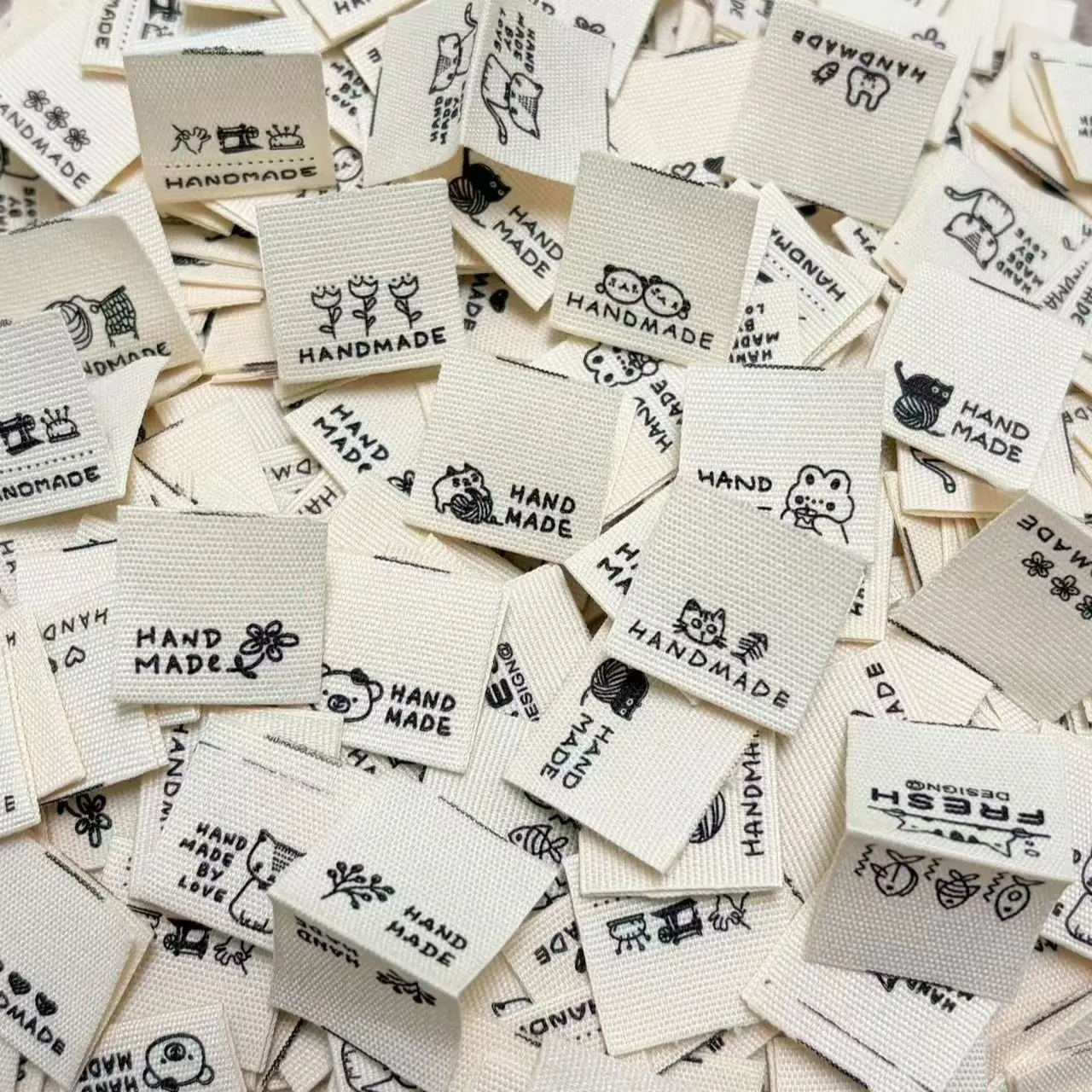 150PCS Assorted Style Cute Cartoon Handmade Fabric Labels, Double-fold Fabric Labels for DIY Sewing, Hair Scrunchies, Clothes Side Tags & Bags, Designs
