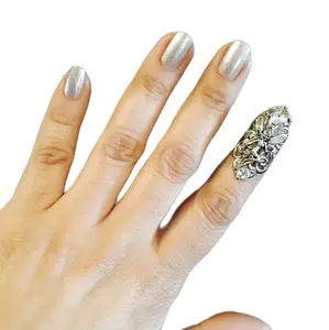 Fairy claw ring, nail guard or finger tip made in a dull silver color, adorned with a fairy charm and clear crystals ,sizable.