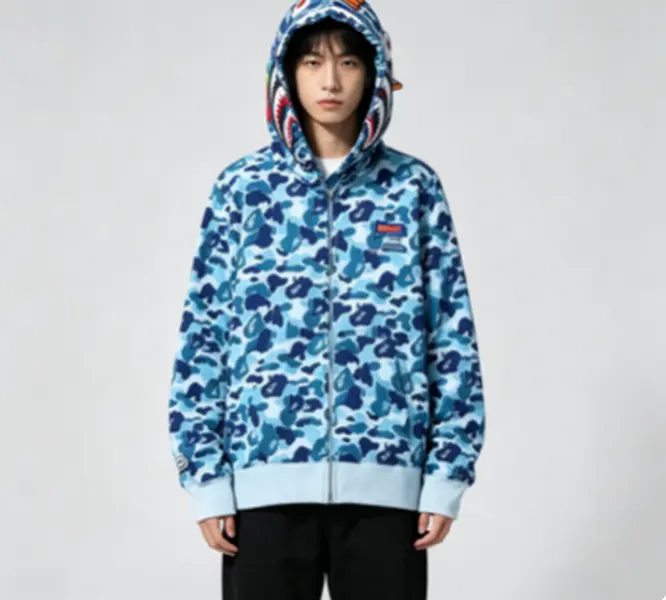 Blue camo shark hooded sweatshirt, all over light and dark blue camo print fabric, shark graphic on hood, zip up hoodie, hip hop casual top