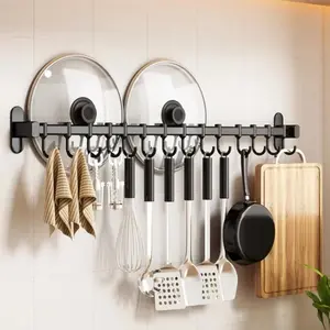 Flexible wall - mounted kitchen utensil rack equipped with movable hooks. Ideal for storing pot shovels, spoons, etc., it's essential for kitchen organization.Decorative hooks