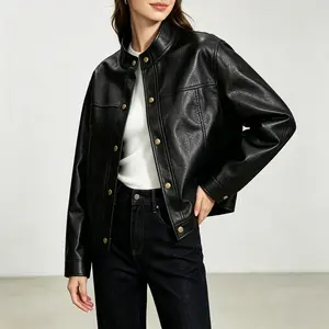 Women’s black stand-collar leather jacket with vintage gold buttons, short length—versatile biker style for autumn/winter