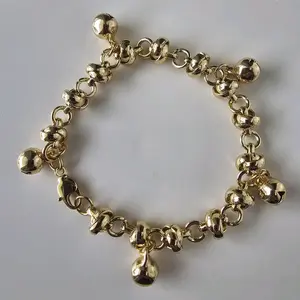 Goldplated knotted bracelet with bells that chime-Pulso laminado con 5 cascabeles que suenan