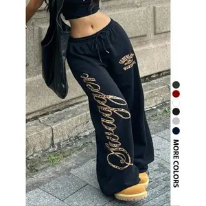 Women’s “daughter” leopard-print oversized sports pants; black multifunctional wide-leg pants; Y2K-style streetwear essential; an ideal choice for everyday styling; a great gift for urban travelers and fans of alternative fashion. GARMENTARY