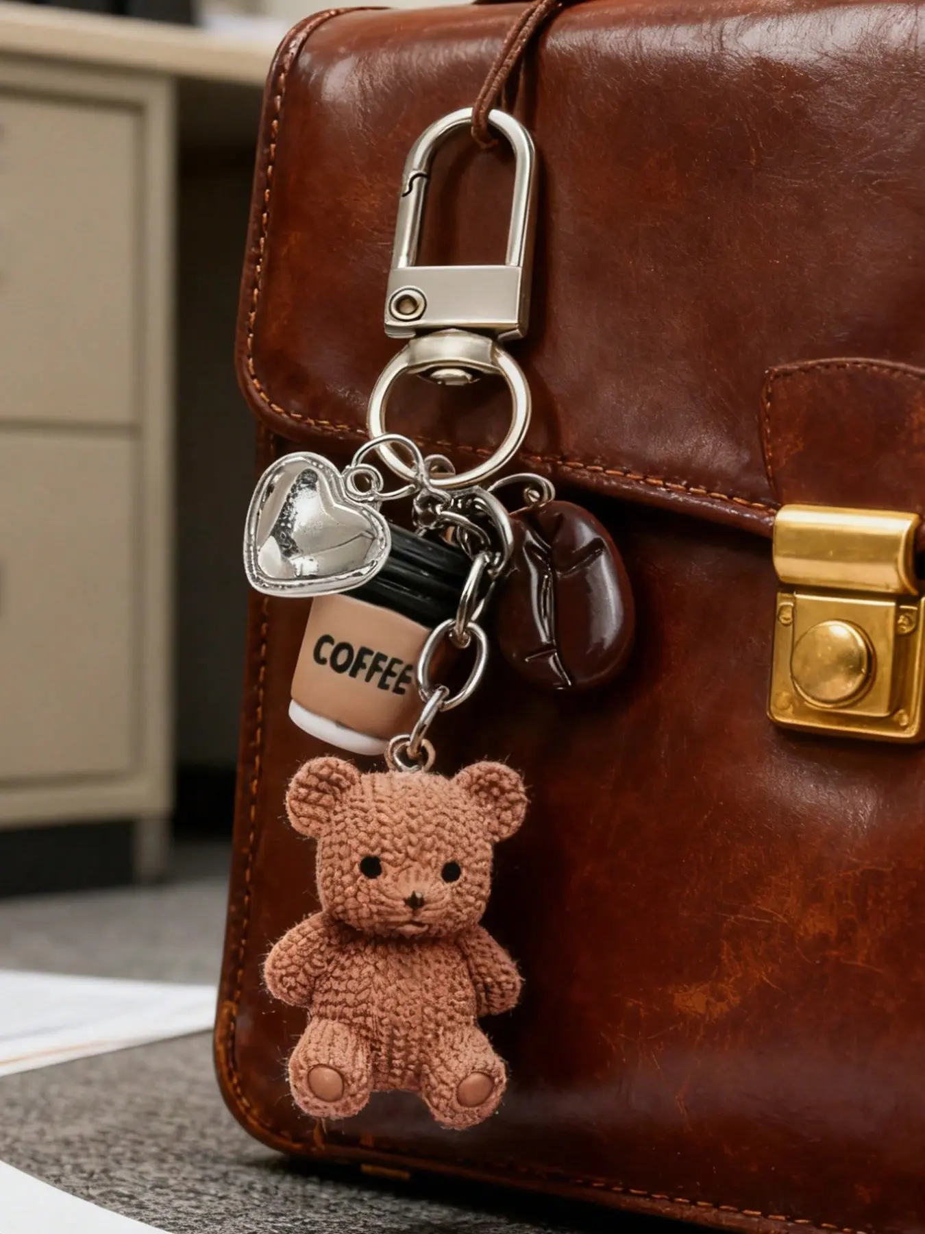 A coffee teddy bear keychain bag charm, a cute and stylish accessory for your bag and keys! This charm includes a knitted teddy bear, a mini coffee cup, a coffee bean, and a sparkling heart pendant, Keychain Accessories