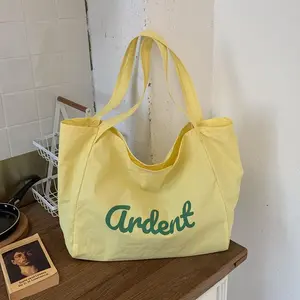 Summer new canvas bag bag large capacity shopping bag commuter shoulder bag simple letter drawstring hand bag