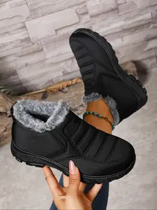 A pair of women's thickened and lined Casual Ankle Boots with plush lining for the elderly in winter, featuring soft rubber soles that are waterproof and anti-slip, fabric lining and insoles, and stylish outdoor snow boots, Waterproof Footwear