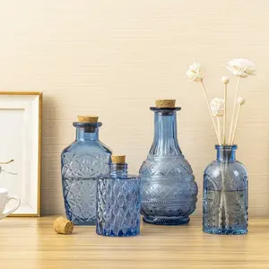 Small Blue Glass Reed Diffuser Bottles, Embossed Apothecary Style Flower Bud Vases with Cork Lids, Set of 4