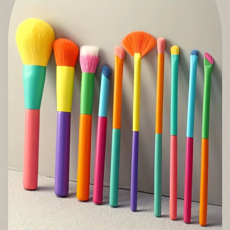 A set of 10 ultra-soft rainbow makeup brushes, including foundation, eye shadow, powder blusher, and specialized brushes for eyebrows and lips