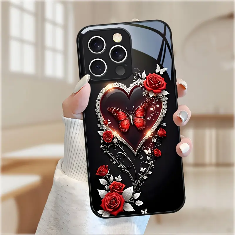 This phone case features a romantic design with rhinestone-encrusted red hearts and roses. It has a skin-friendly feel, a glass-like texture, and a white finish. Compatible with iPhone 17, 16, 15, 14, 13, 12, 11, and Samsung models.