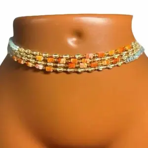 AAESSENTIALS Carnelian Tumbled Stone Crystal Waist Beads 1 Strand - Orange & Gold Colorway Fashion Accessory for Women