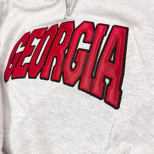 Georgia Appliqué Varsity Style Quarterzip Pullover with Bold Red Lettering and Comfortable Fit