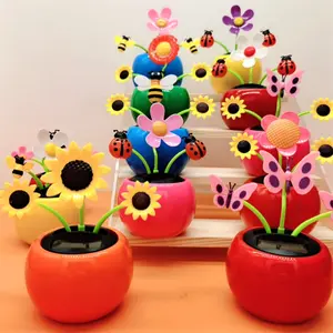 Creative intelligent induction swing sunflower shaking head apple flower car decoration car ornament