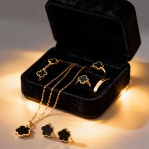 black four-leaf clover jewelry set for women, including necklace, bracelet, earrings, and ring. A perfect gift for your girlfriend, ideal for Christmas, dates, or office use.