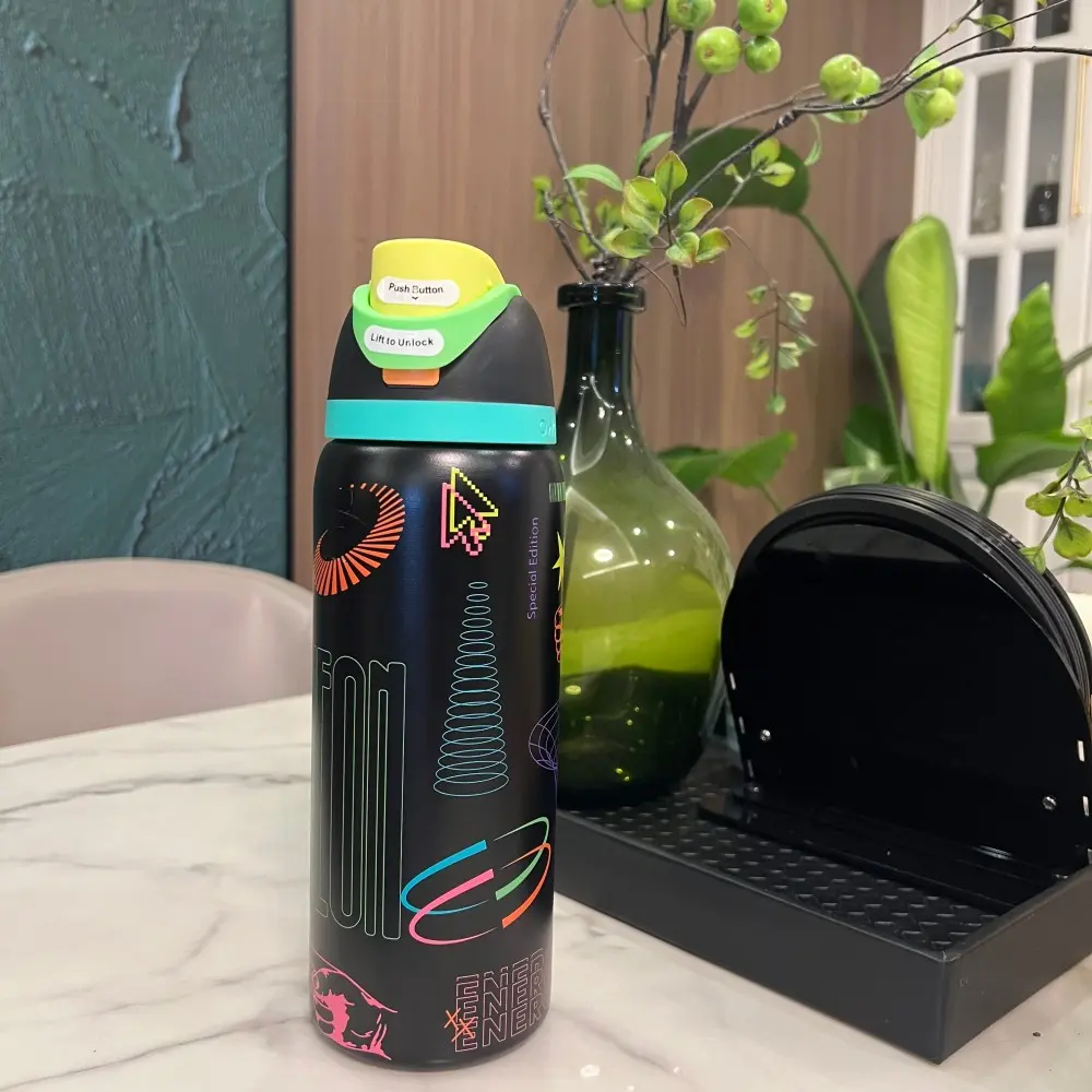 Owala FreeSip Stainless Steel Leak-Proof Vacuum Flask - 32oz Water Bottle, 32 oz Tumbler, Black with Graffiti Print Accent, Straw-Equipped, Ideal for Commute & Gym, Neon Accent