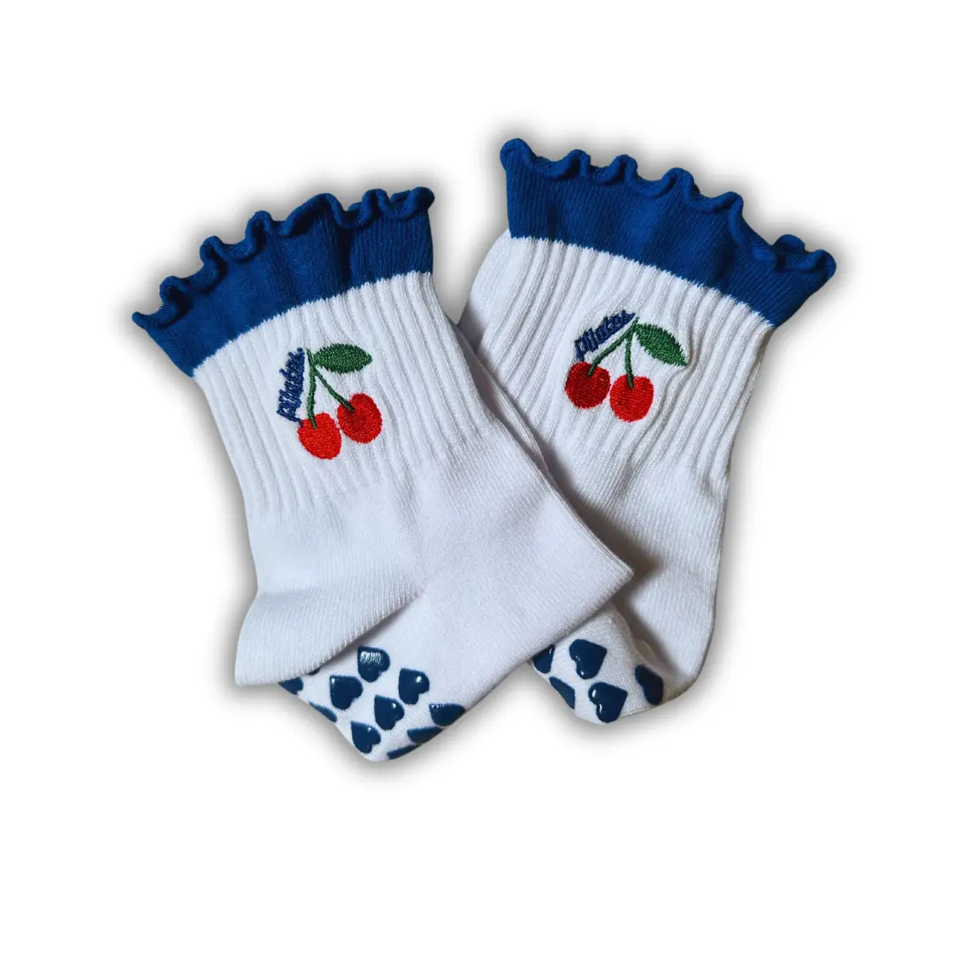 Dark blue ruffle cherry "pilates" grip sock with dark blue heart grips for pilates, yoga, barre or lagree