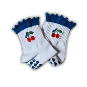 Dark blue ruffle cherry "pilates" grip sock with dark blue heart grips for pilates, yoga, barre or lagree