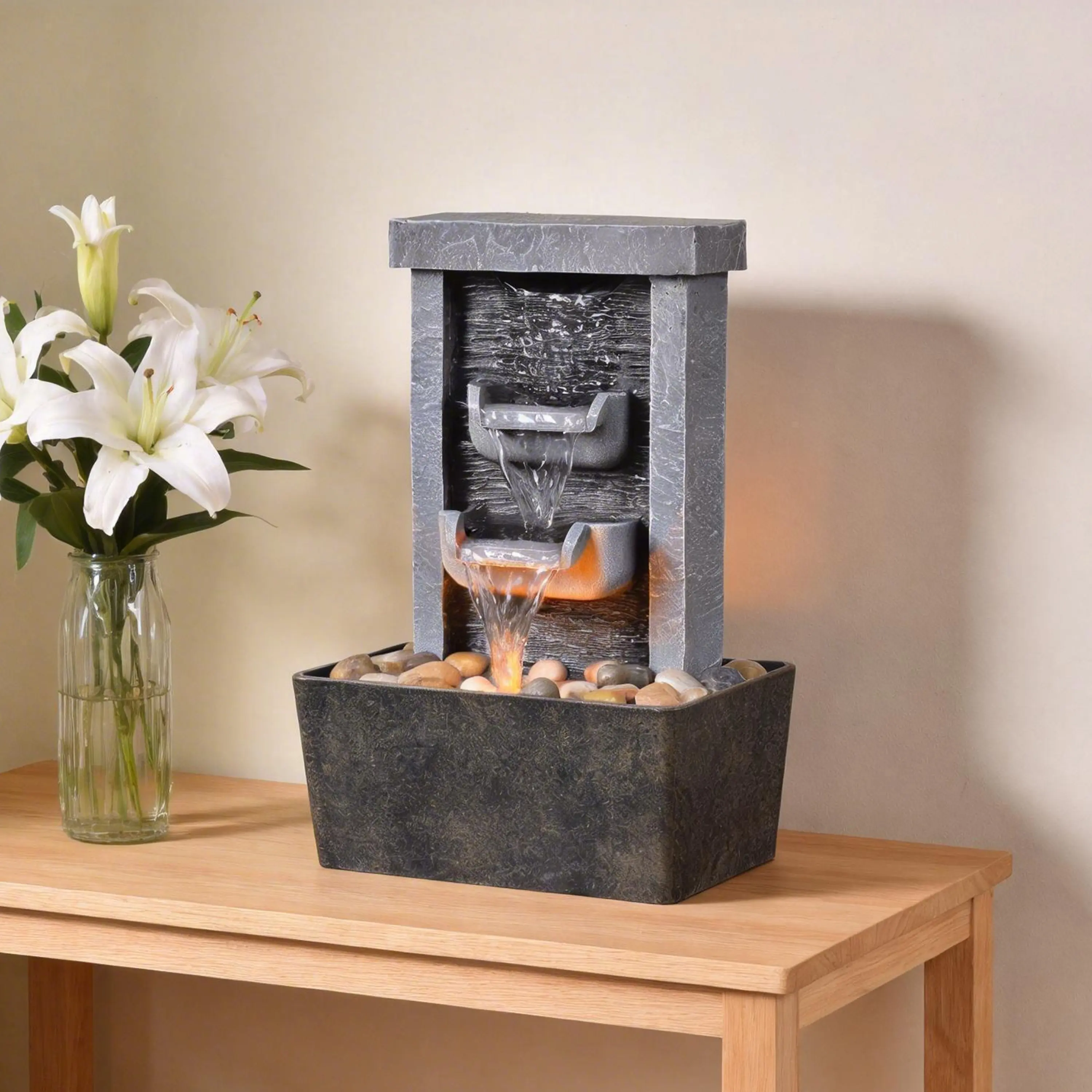 Resin indoor table waterfall fountain with silent high-pressure pump, reflective LED light & realistic river rocks. Gentle circulating water sound relieves stress, compact size perfect for desk decor at home & office.