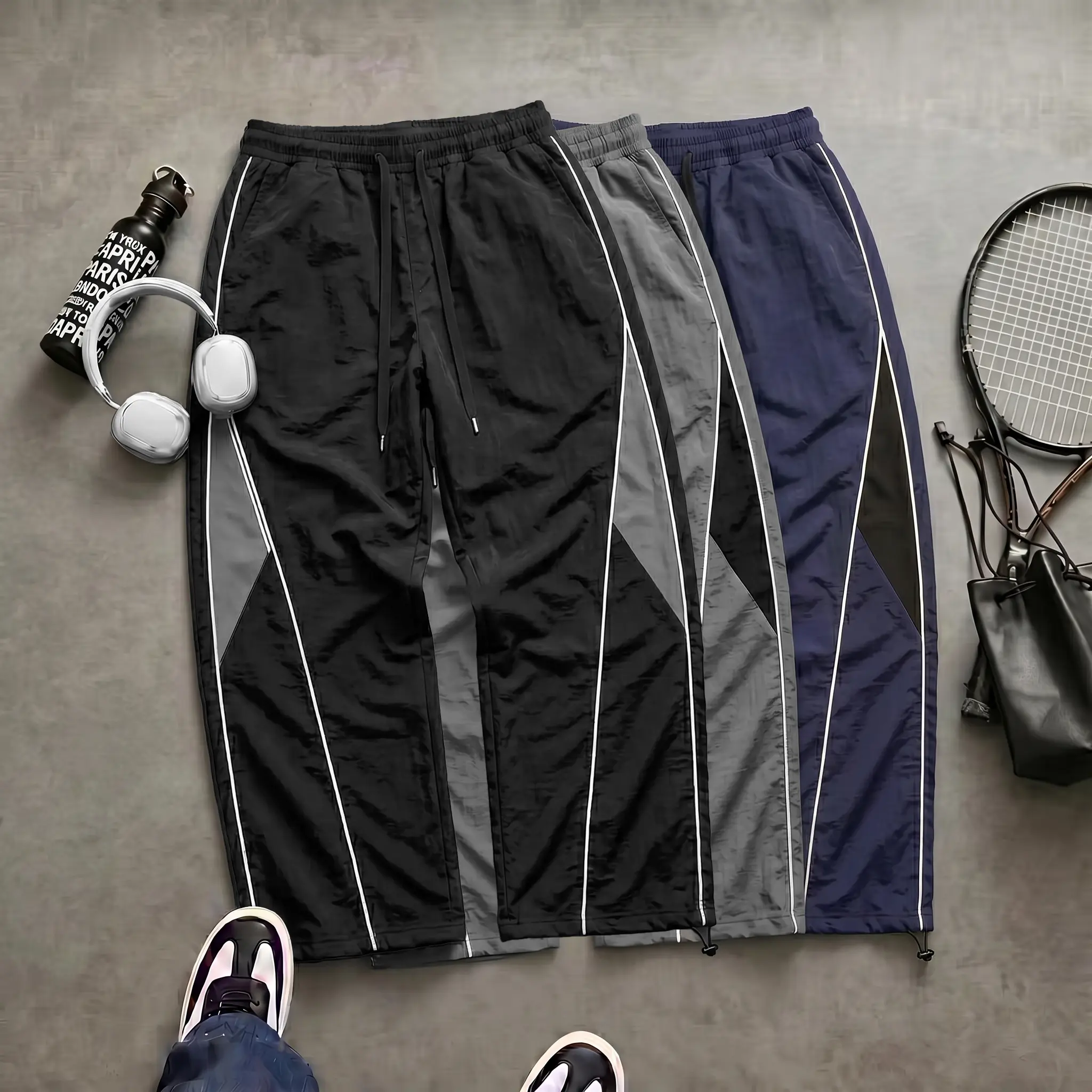 Men’s high-street wide-leg pants featuring contrast panels, side stripes, and a drawstring; American retro loose, drapey athletic pants; slim casual pants suitable for autumn, winter, and summer. Men's long pants, solid color